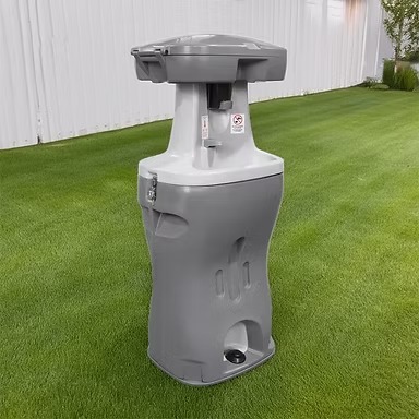 Portable hand washing station with foot pump